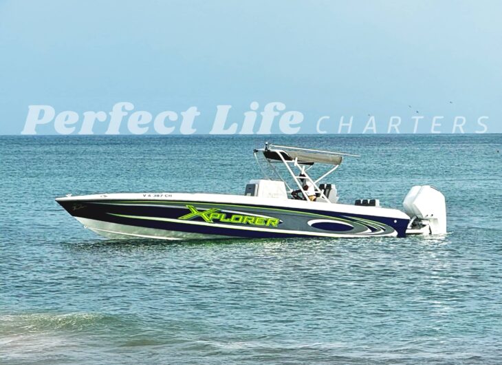 Perfect Life Charters’ Xplorer, a 30’ Wellcraft Scarab 302, sitting in calm Caribbean waters in St. Kitts and Nevis.